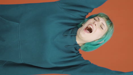 Vertical-video-of-Sleepy-young-woman-yawns.